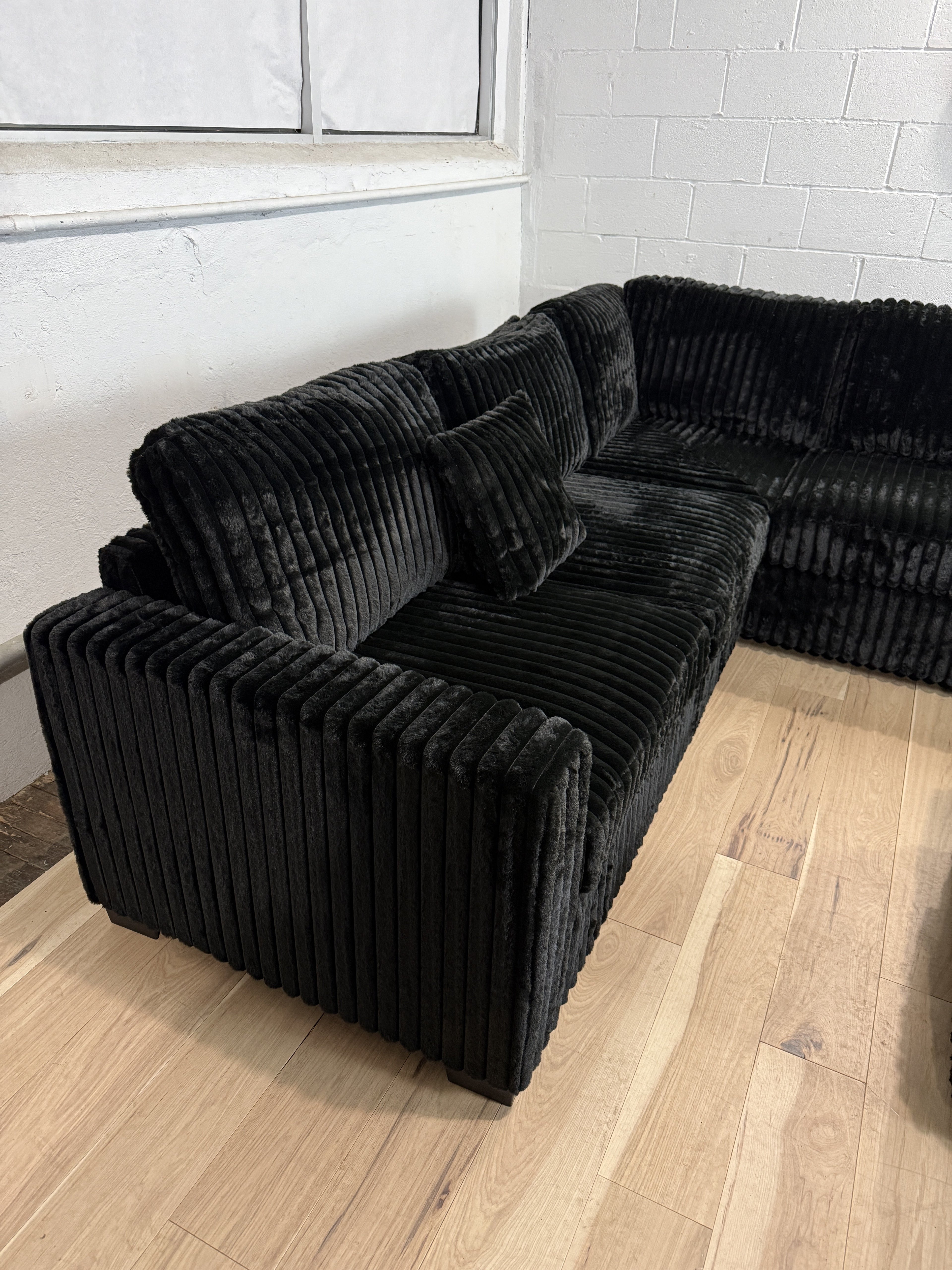 Plush Black Corduroy Sectional Sofa + Ottoman
